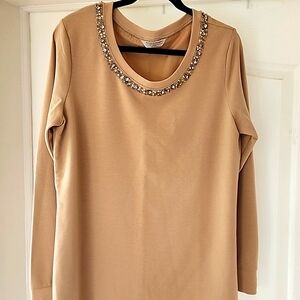Tan sweatshirt with beaded neckline.